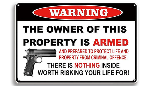 Metalen wandbord | Warning | The owner of this property is armed |