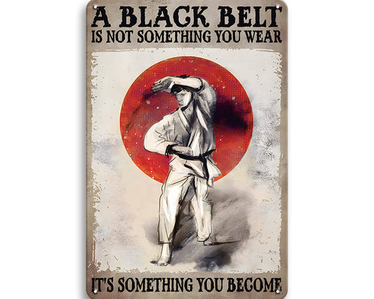 Metalen wandbord | A black belt is not something you wear |